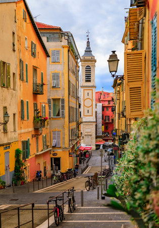 Nice, France - May 25, 2022: View onto Place Rossetti and Sainte Reparate Cathedral Basilique, blurred jasmine blossom in foreground, French Rivieraのeditorial素材