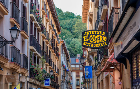 San Sebastian, Spain - June 25, 2021: Basque restaurants and bars famous for pintxos or tapas in the narrow streets, old town Donostia, Basque Countryのeditorial素材