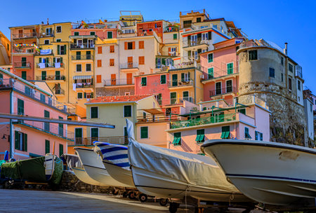 Daytime view onto the traditional fishing boats and colorful terracotta houses in old town of...