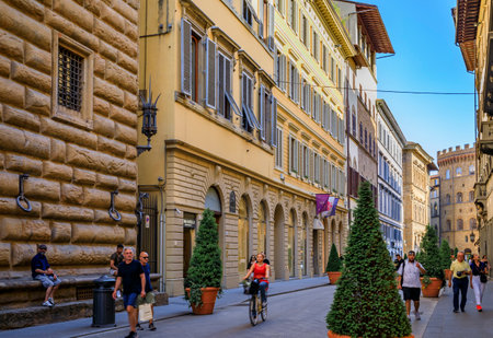 Florence, Italy - June 02 2022: Tourists and locals walk among gothic buildings on Via de Tornabuoni, major high end shopping street in Centro Storicoのeditorial素材