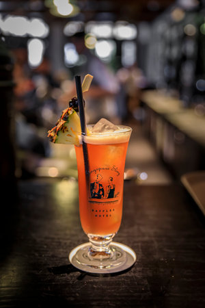 Singapore - September 08, 2019: Singapore Sling cocktail at the iconic Raffles Hotel Long Bar, famous for inventing itのeditorial素材