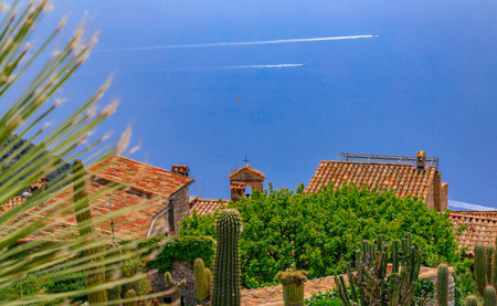 Scenic view of the Mediterranean coastline and medieval houses from the top of the town of Eze village on the French Rivieraの写真素材