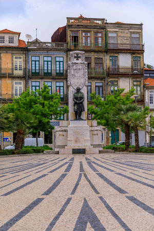 Porto Portugal - May 30, 2018: Praca de Carlos Alberto square with ornate cobblestone design leading up to Monument to the Dead of Great War 1914-1916のeditorial素材