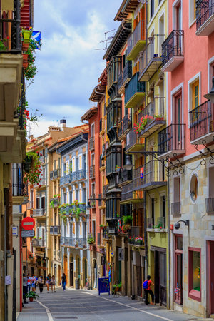 Pamplona, Spain - June 21, 2021: Colorful house facades and ornate metal balconies in the old town or Casco Viejo famous for running of the bullsのeditorial素材