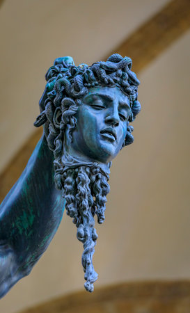 Benvenuto Cellini 1554 statue Perseus with Medusa head in Loggia dei Lanzi by Palazzo Vecchio on public Square Piazza della Signoria, Florence, Italyのeditorial素材