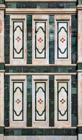 Ornate colorful marble facade of the Duomo Cathedral or Cattedrale di Santa Maria del Fiore, Florence, Italy known for the red tiled Brunelleschi domeの写真素材