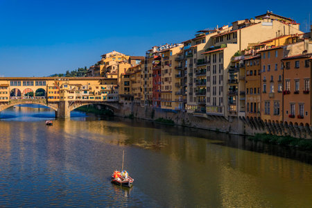 Cityscape with the famous bridge of Ponte Vecchio on the river Arno River in Centro Storico, Florence, Italyの写真素材
