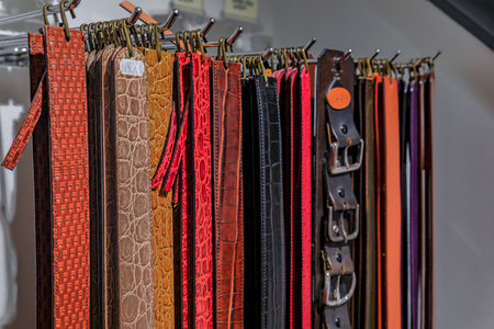 Colorful leather goods, selection of custom made belts on display at an artisanal shop in Centro Storico, Florence, Italyの写真素材