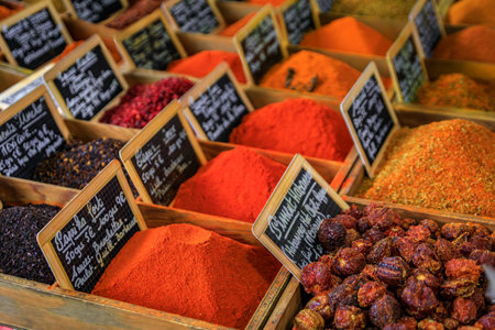 Bulk spices, paprika, chili habanero peppers and curry at a local provencal farmers market hall in the old town or Vieil Antibes, South of Franceの写真素材
