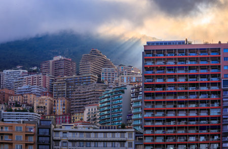 Monte Carlo cityscape with luxury apartment buildings by the port of Monaco, Cote dAzur on the French Riviera at the golden hour of sunsetの写真素材