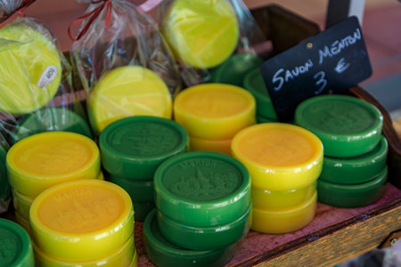 Colorful natural yellow lemon scented handmade soap at a local farmers market in the Old Town Vieille Ville in Menton, French Riviera, South of Franceのeditorial素材