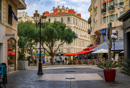 Nice, France - May 29, 2023: Restaurants and bars on a busy square in the Old Town, Vieille Ville, French Rivieraのeditorial素材