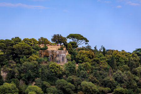 Cascading waterfall atop Castle Hill or Colline du Chateau at the park in Nice, tourist landmark of French Riviera, South of Franceの写真素材
