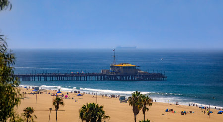 Santa Monica Pier with the Ferris wheel and the sandy beach, a famous tourist destination in Los Angeles California, USAの写真素材