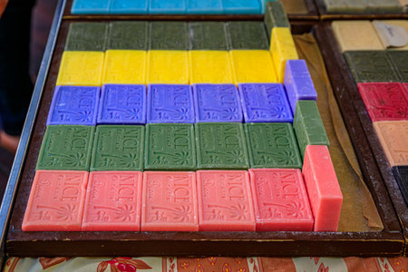 Nice, France - May 28 2023: Colorful natural handmade lavender, olive, rose, lemon and verbena scented soap in wooden boxes at the Cours Saleya marketのeditorial素材