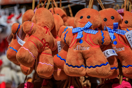 Strasbourg, France - May 31 2023: Traditional Alsatian gingerbread man plush toys on display at a souvenir store in the old town on Grande Ileのeditorial素材