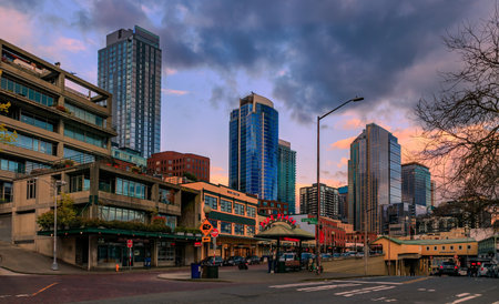 Seattle, Washington - April 27, 2022: City waterfront skyline with skyscrapers by the famous Pike Place Market at a colorful sunsetのeditorial素材