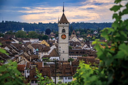 Scenic aerial view of Schaffhausen, Switzerland below the Munot fortress, vibrant vineyards and the Protestant Church of St Johann in the distanceの写真素材