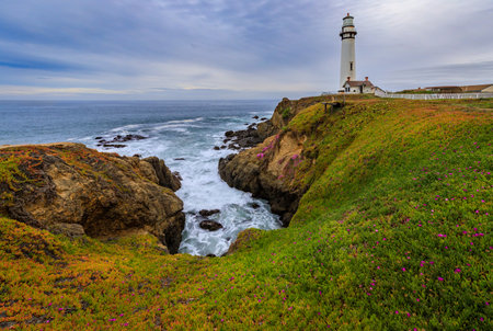 Waves crashing on the shore by Pigeon Point Lighthouse on Northern California Pacific Ocean coastline near Pescadero just before sunsetの写真素材