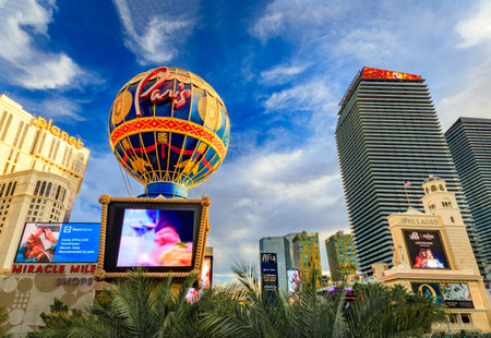 Las Vegas, Nevada, USA - October 24, 2021: A hot air balloon replica with Paris branding among other Strip hotels and casinos under a cloudy sky.のeditorial素材