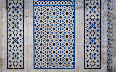 Elaborate stone tile mosaic with intricate details on the exterior of the Nuruosmaniye mosque, historic architecture in Istanbul, Turkeyの写真素材