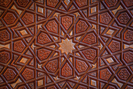 An intricate wooden panel featuring traditional Islamic girih geometric star patterns on a door within the Suleymaniye Mosque, in Istanbul, Turkeyの写真素材