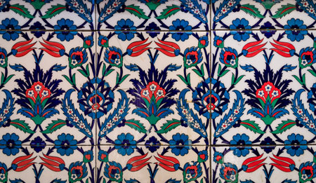 Ornate blue and red handmade Turkish Iznik mosaic tiles with floral Islamic patterns in a...