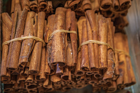 A vibrant display of bright orange safran and other colorful spices in buckets at a bustling bazaar market, trade and food culture, Istanbul, Turkeyの写真素材