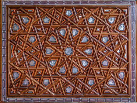 An intricate wooden panel with traditional Islamic girih geometric star patterns on a door within the Yeni Cami or the New Mosque, in Istanbul, Turkeyの写真素材