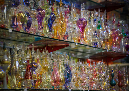 A close-up view of beautiful, ornate glass perfume bottles on display in a shop at the historic...
