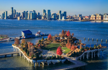 Little Island, a unique modern park at Pier 55 with a futuristic design and a cityscape in the...