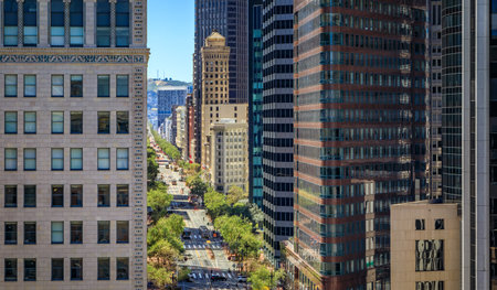 An aerial view down busy Market Street with towering iconic skyscrapers, a quintessential cityscape of San Francisco in Californiaの写真素材
