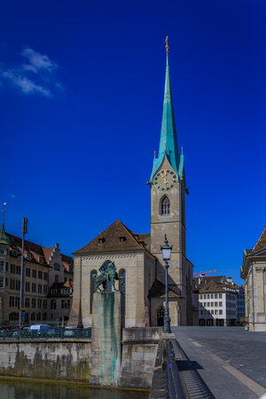 Cityscape with the iconic Fraumunster church and classic buildings on the banks of the Limmat River in the Altstadt or Old Town in Zurich, Switzerlandの写真素材