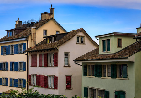 A picturesque street in historic Old Town, lined with classic buildings, traditional architecture,...