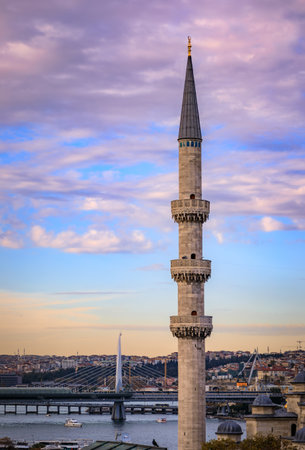 Evening cityscape of the Historic Peninsula and Golden Horn with Yeni Cami or New Mosque minaret and Golden Horn bridge at sunset in Istanbul, Turkeyの写真素材
