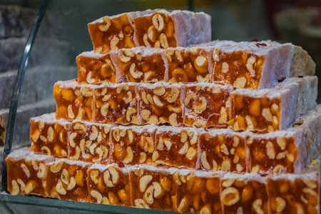 Selection of turkish delight nougat with hazelnut candy neatly arranged on display at the Egyptian Bazaar, Istanbul, Turkeyの写真素材