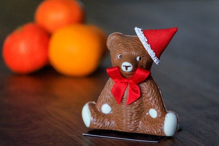 Fresh, gourmet chocolate bear wearing a Santa hat, a seasonal specialty, delightful Christmas treat from an artisanal chocolatier, Zurich, Switzerlandの写真素材
