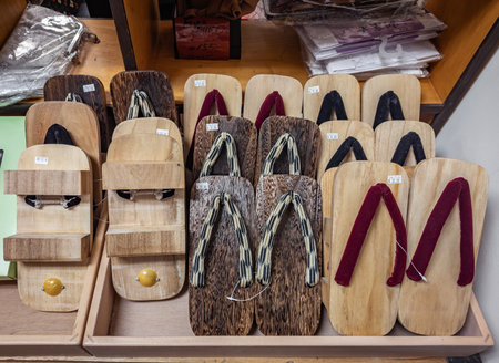 San Francisco, USA - March 13, 2025: Wooden geta sandals, traditional Japanese footwear, arranged in rows on a shelf in a souvenir shop in Japantownの写真素材