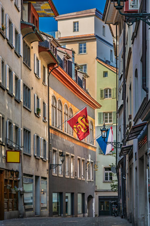 A picturesque street in historic Old Town, lined with classic buildings, traditional architecture, wooden shutters in Altstadt, Zurich, Switzerlandの写真素材