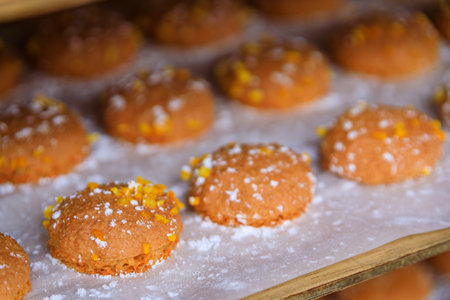 Fresh almond macaroon cookies with price tags displayed at the Cours Saleya street market in the Old...