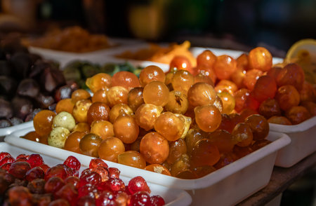 Whole candied glazed figs on display at a confectionery stand in the Cours Saleya provencal farmers market in the Old Town of Nice, South of Franceの写真素材