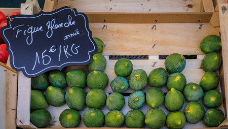 Ripe local white figs on a fruits and vegetables stand in the Cours Saleya provencal farmers market in the Old Town of Nice, South of Franceの写真素材
