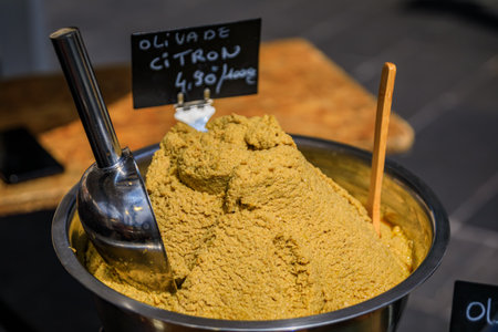 Olive and lemon tapenade or olivade at a stand in the Cours Saleya provencal farmers market in the Old Town of Nice, South of Franceの写真素材