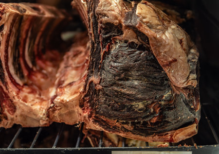 Dry aged bone-in ribeye steak on display at a typical French butcher shop counter in the Old Town of Nice, South of Franceの写真素材