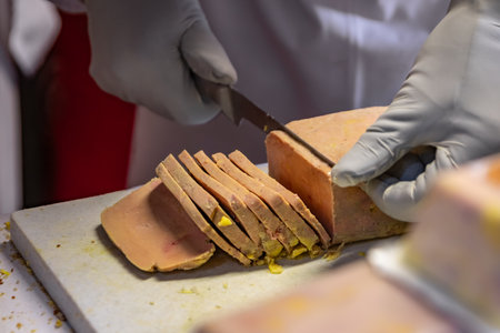 A block of foie gras sliced and ready to be used for gourmet sandwiches at a Chrismas Market chalet in Strasbourg, Franceの写真素材
