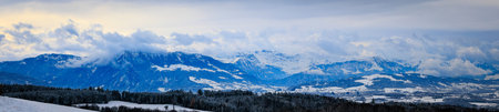 Winter wonderland in Aeugst am Albis, Switzerland, a picturesque view the snow covered Alps...