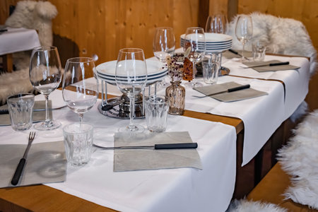 Rustic winter wonderland: wooden tables, cozy fur throws and festive touches at a fondue chalet...
