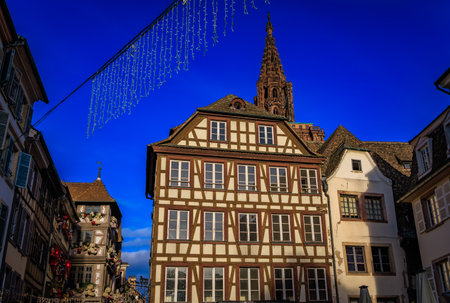 Festive decorations, angel ornaments, and historic half timbered houses in the background, during...