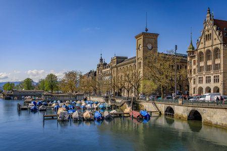 Cityscape with the iconic Fraumunster church and classic buildings on the banks of the Limmat River in the Altstadt or Old Town in Zurich, Switzerlandの写真素材