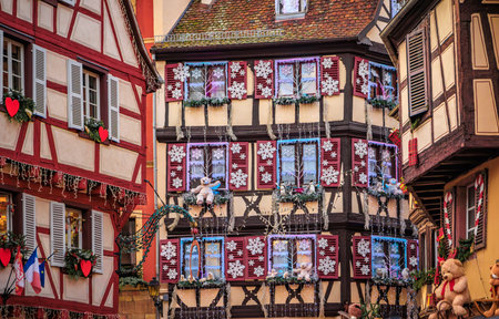 Festive decorations and teddy bears on half timbered houses during the Christmas Market in the Little Venice Old Town of Colmar, Alsace, Franceの写真素材